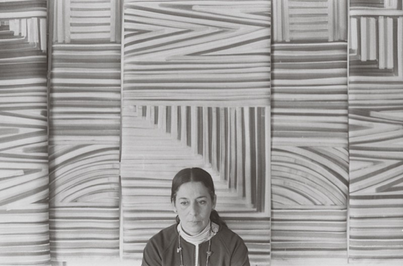 Hurtado in front of 'Self Portrait', photograph by Matt Mullican, c.1973